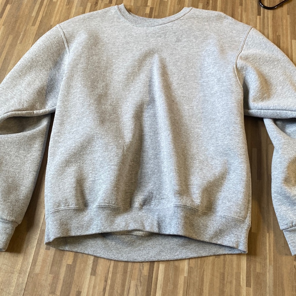 Light gray crew neck. Never been worn no tags.